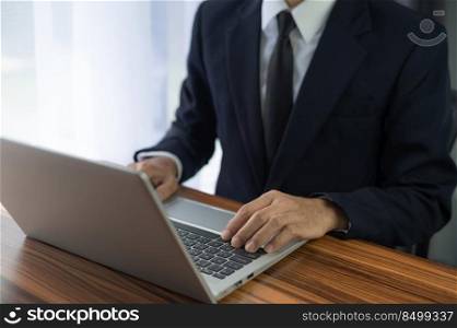 Businessman using laptop computer in office smart technology