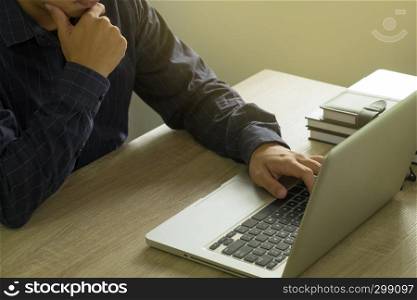 Businessman using laptop to the situation on the market value , Business concept