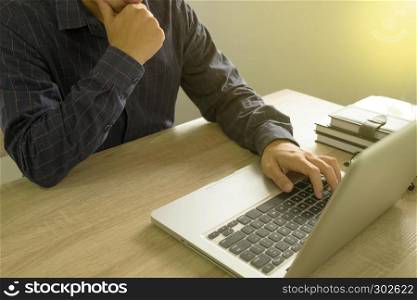 Businessman using laptop to the situation on the market value , Business concept