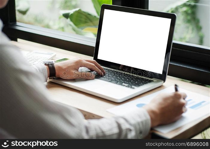 businessman using laptop with blank screen at cafe