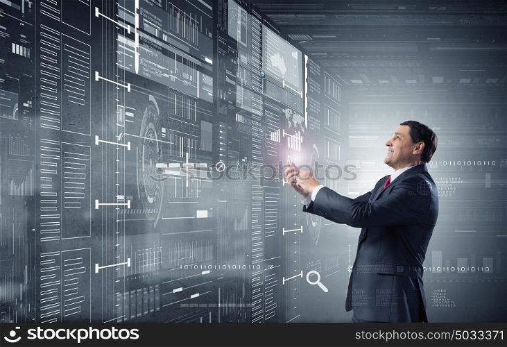 Businessman using mobile application. Businessman on digital futuristic background using his smartphone