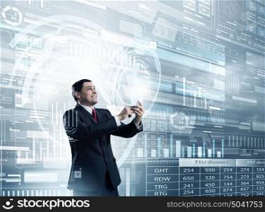 Businessman using mobile application. Businessman on digital futuristic background using his smartphone
