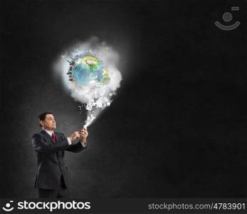 Businessman using mobile application. Businessman using his smartphone and Earth planet out of screen. Elements of this image are furnished by NASA