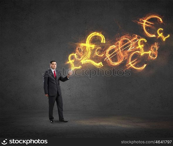Businessman using mobile application. Businessman using his smartphone and glowing currency signs coming of screen