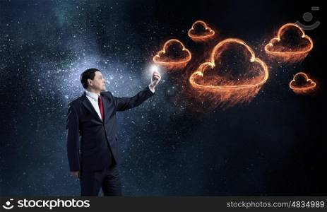 Businessman using mobile application. Businessman using his smartphone and glowing light out of screen