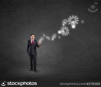 Businessman using mobile application. Businessman using his smartphone and glowing percent sign of screen