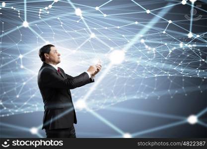 Businessman using mobile application. Businessman using his smartphone on background of connection lines