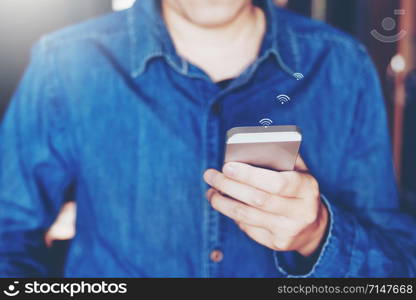 Businessman using mobile online icon social networking connection on screen