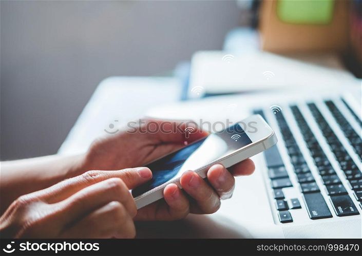 Businessman using mobile online icon social networking connection on screen