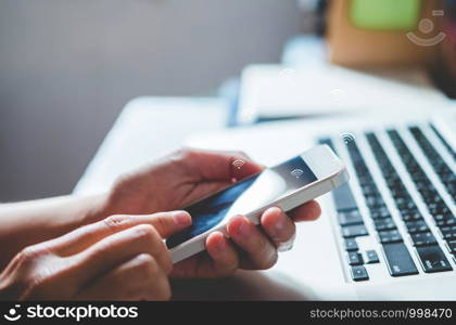 Businessman using mobile online icon social networking connection on screen