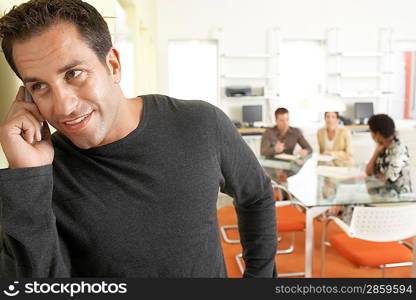 Businessman using mobile phone in office