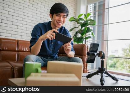 businessman using smart phone taking live sell online. concept working form home