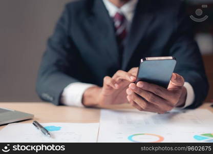 Businessman using smartphone to checking report while analysis financial and accounting of project.
