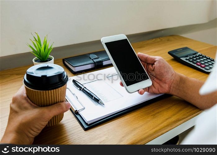 Businessman using smartphone to the situation on the market value , Business concept.