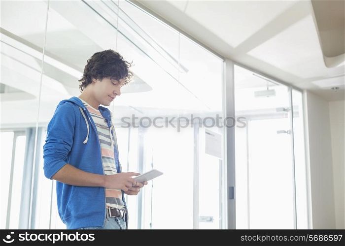 Businessman using tablet PC in creative office