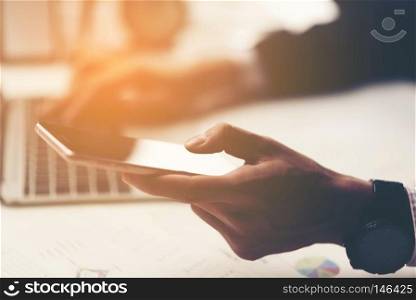 businessman using tablet smartphone for working in the office