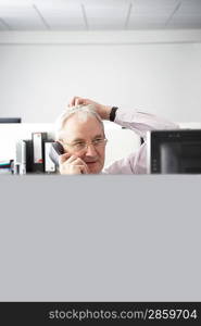 Businessman Using Telephone