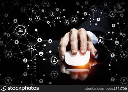 Businessman using wireless mouse. Hand of businessman on dark 3D rendering background using wireless mouse