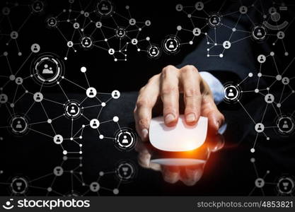 Businessman using wireless mouse. Hand of businessman on dark 3D rendering background using wireless mouse