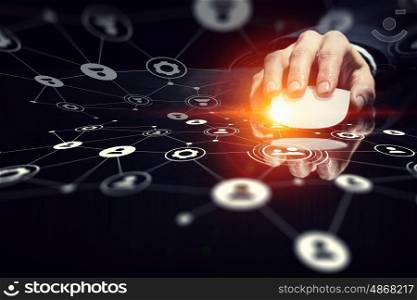 Businessman using wireless mouse. Hand of businessman on dark 3D rendering background using wireless mouse