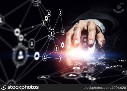 Businessman using wireless mouse. Hand of businessman on dark 3D rendering background using wireless mouse