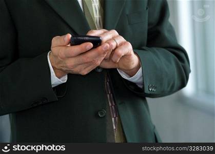 Businessman, using wireless PDA.