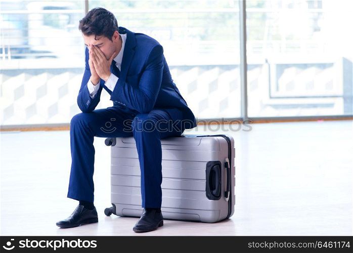 Businessman waiting for his flight at airport
