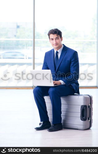 Businessman waiting for his flight at airport