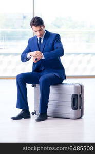 Businessman waiting for his flight at airport