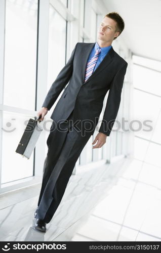 Businessman walking in corridor