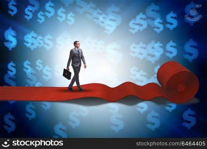 Businessman walking on red carpet