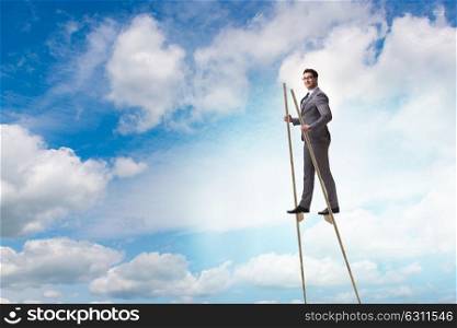 Businessman walking on stilts - standing out from the crowd