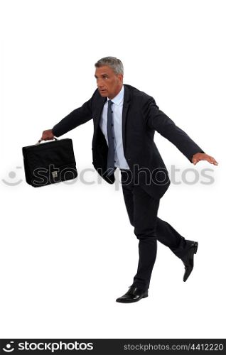Businessman walking on tight-rope