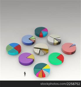 businessman walking to 3d Pie charts, made of different metals as concept