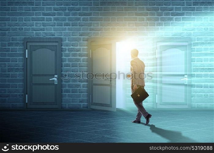 Businessman walking towards open door