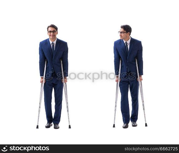 Businessman walking with crutches isolated on white background. The businessman walking with crutches isolated on white background