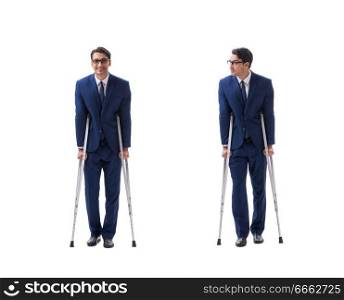 Businessman walking with crutches isolated on white background. The businessman walking with crutches isolated on white background