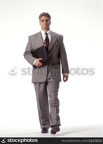 Businessman Walking with Portfolio
