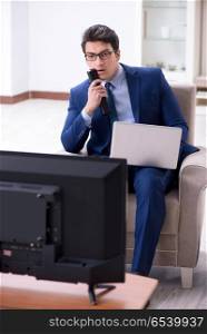 Businessman watching tv in the office