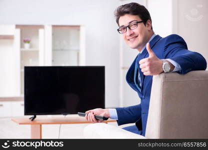 Businessman watching tv in the office