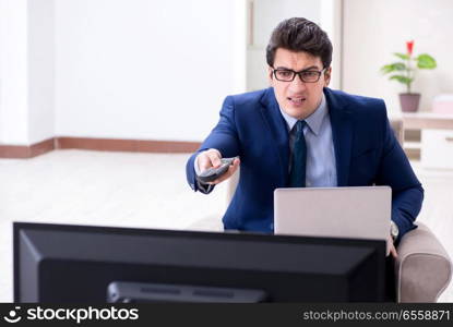 Businessman watching tv in the office