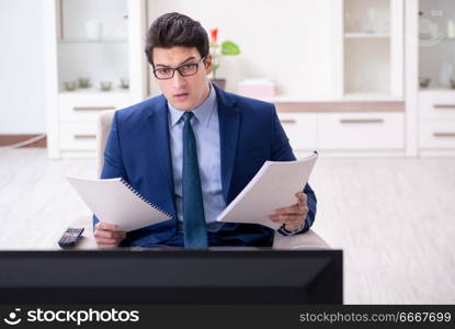 Businessman watching tv in the office