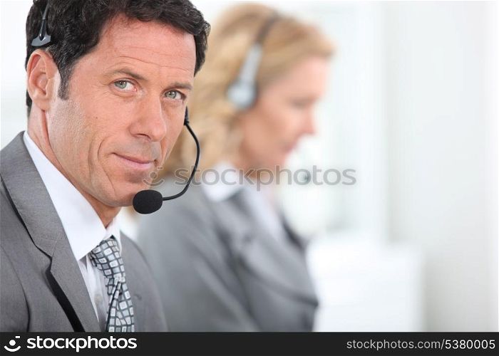 Businessman wearing a telephone headset