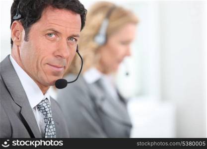 Businessman wearing a telephone headset