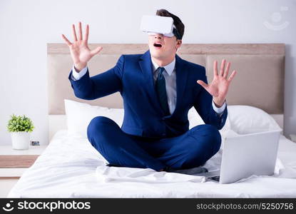 Businessman wearing a virtual reality headset in the bedroom