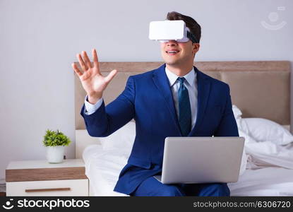 Businessman wearing a virtual reality headset in the bedroom