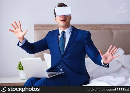 Businessman wearing a virtual reality headset in the bedroom