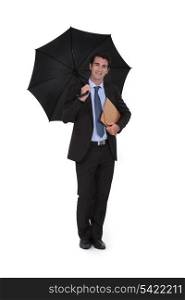 businessman wearing an umbrella
