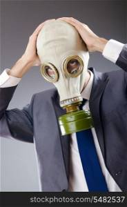Businessman wearing gas mask