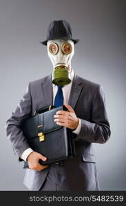 Businessman wearing gas mask